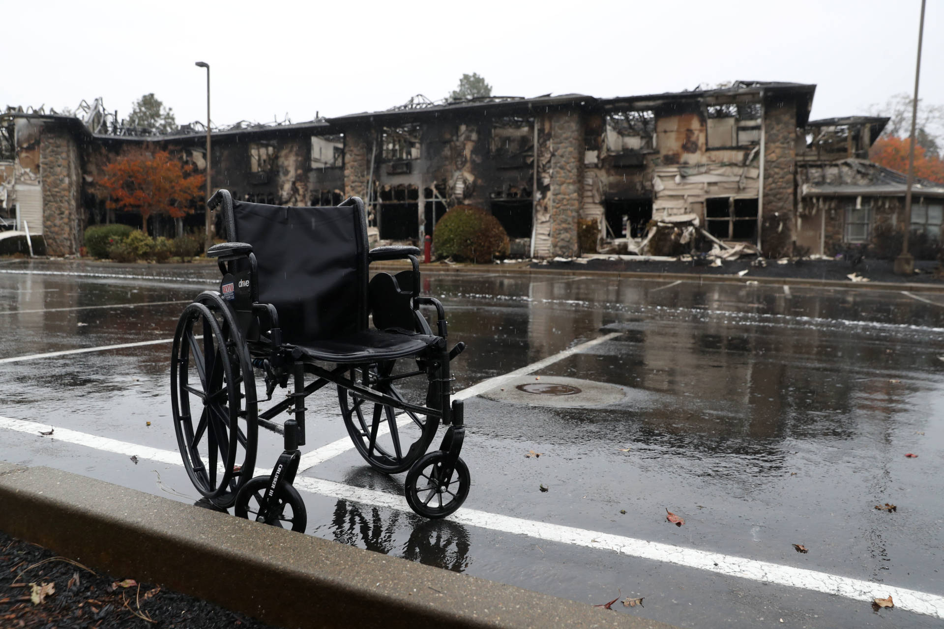 A wheelchair sits in front of a senior living facility that was destroyed by the Camp Fire. The fire killed at least 85 people and destroyed about 14,000 homes.  Justin Sullivan/Getty Images