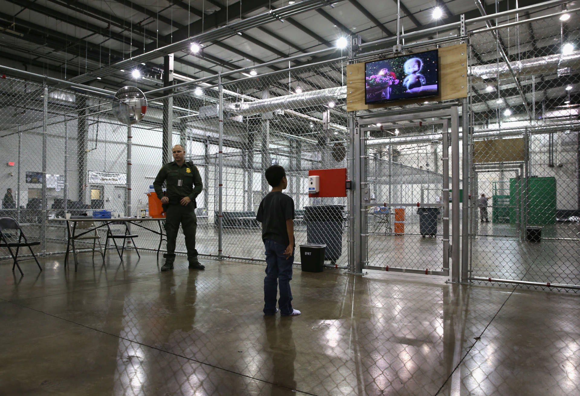 A boy from Honduras watches a movie at a detention facility run by the U.S. Border Patrol on September 8, 2014 in McAllen, Texas.  John Moore/Getty Images