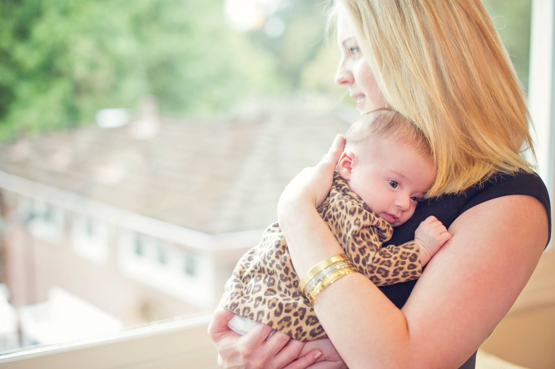 Lisa Abramson holds her daughter, Lucy.  Claire Mulkey