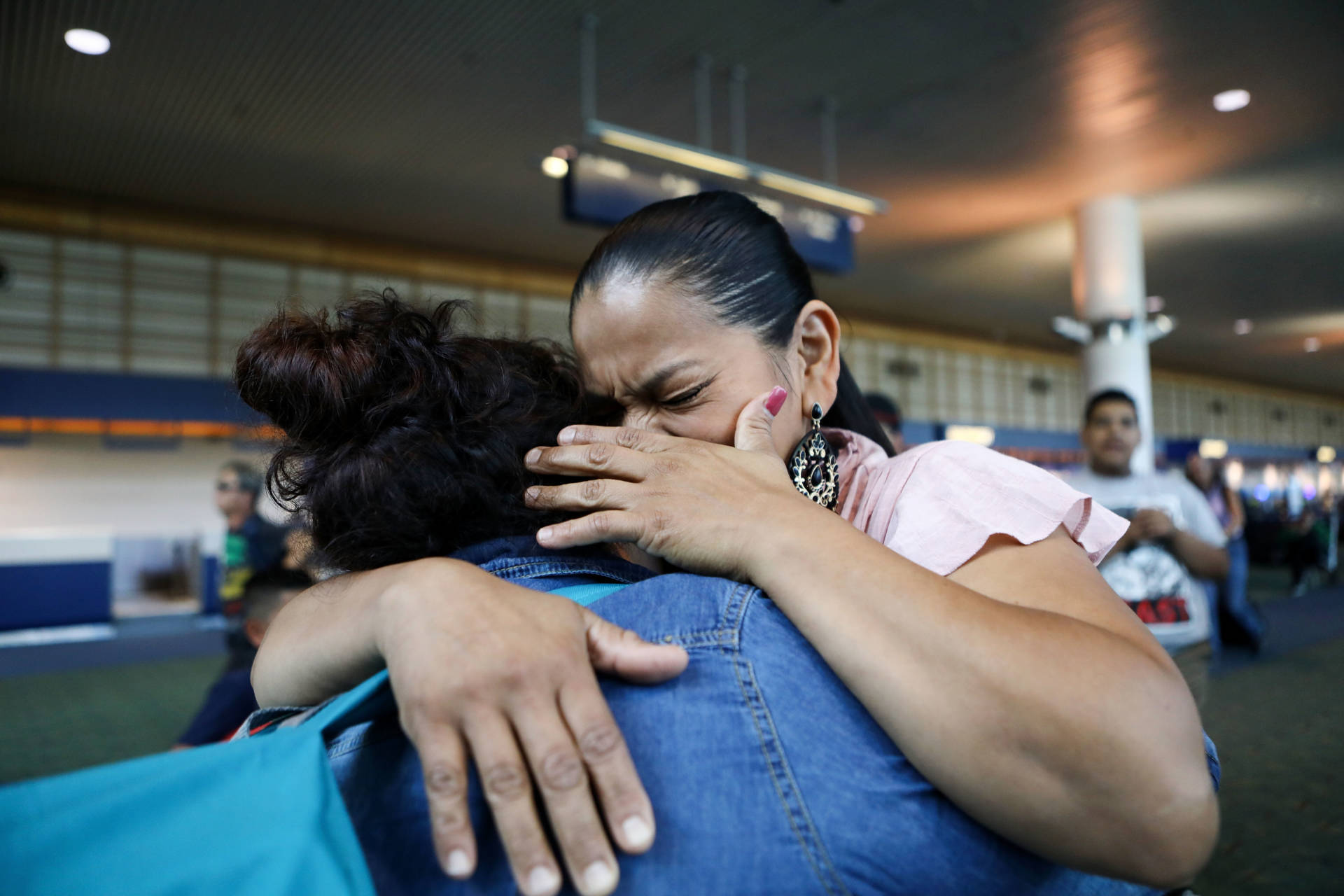An immigrant who identified herself only as Vioney (L), was released after spending six months in an ICE detention facility. She hugged her sister Yadira while being reunited with family on Sept. 2, 2018, in Oregon. Vioney, originally from Mexico, crossed the San Ysidro Port of Entry with three of her children in February, and asked for asylum. She was separated from her three children the same day and held in detention in California until August 31. Her children, who are U.S. citizens, were immediately freed. A group of mothers known as Immigrant Families Together posted her bond, and she will remain in the country with her family while her case is adjudicated.  Mario Tama/Getty Images