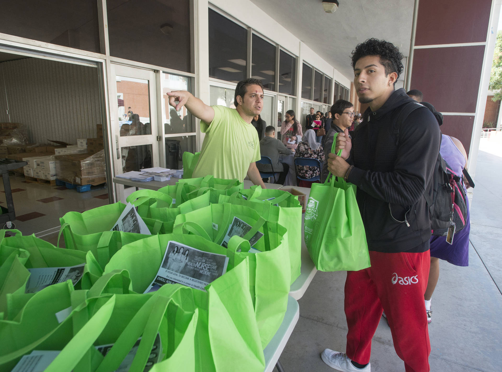 A student picks up groceries at Mount San Antonio College's mobile food pantry. Half of California community college students say they lack reliable access to healthy food. Courtesy of Mount San Antonio College