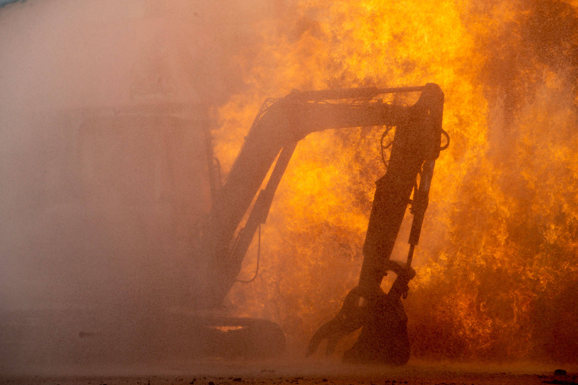 Construction equipment catches fire from a blaze following an explosion of a gas line on Feb. 6, 2019 in San Francisco's Richmond District. Santiago Mejia-Pool/Getty Images