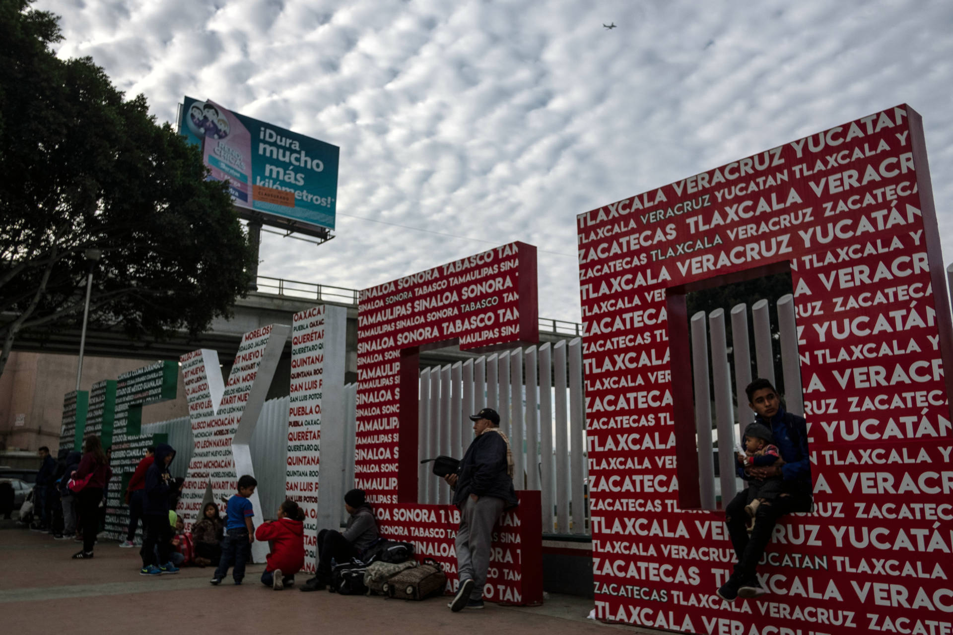 Asylum seekers wait at El Chaparral crossing port at the US-Mexico border, in Tijuana, Baja California state, Mexico, on January 29, 2019. GUILLERMO ARIAS/AFP/Getty Images