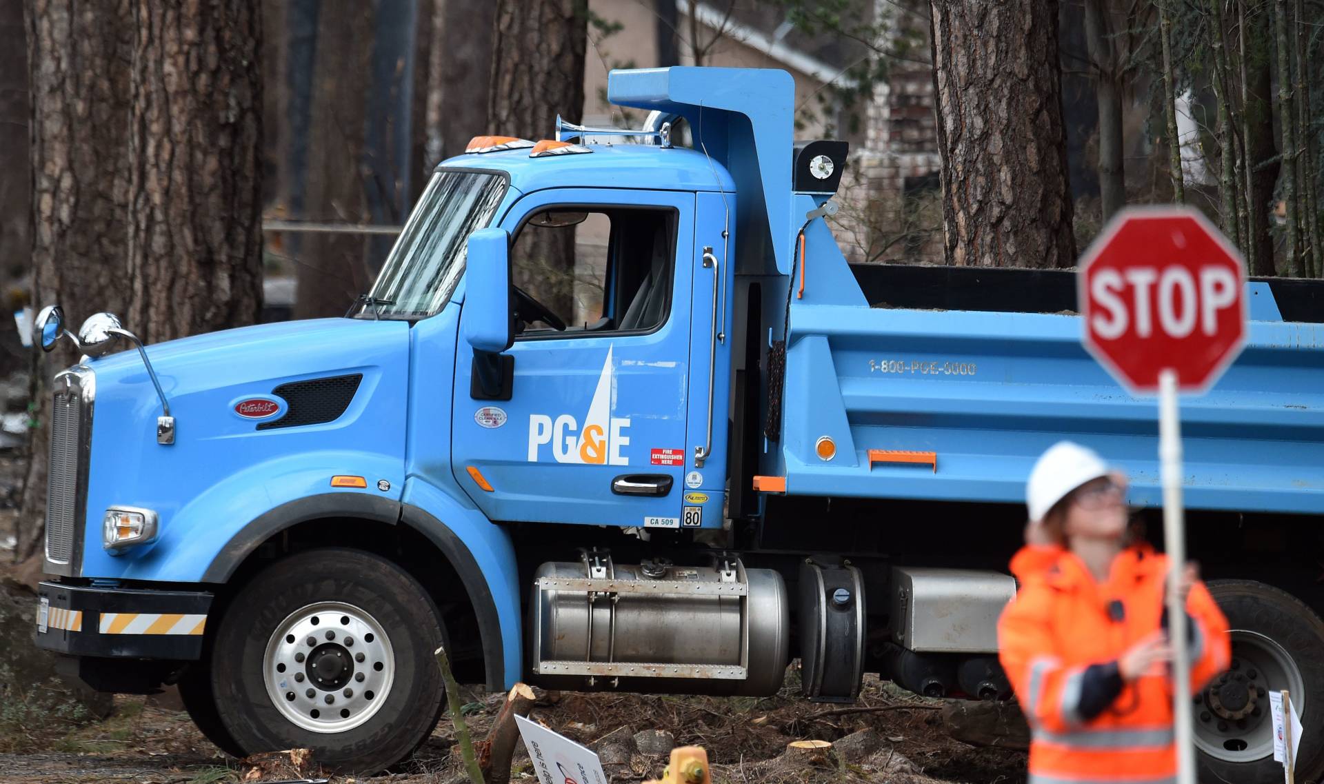 PG&amp;E crews worked in early February to restore utility service in Paradise, mostly destroyed by last November's Camp Fire.  Josh Edelson/AFP-Getty Images
