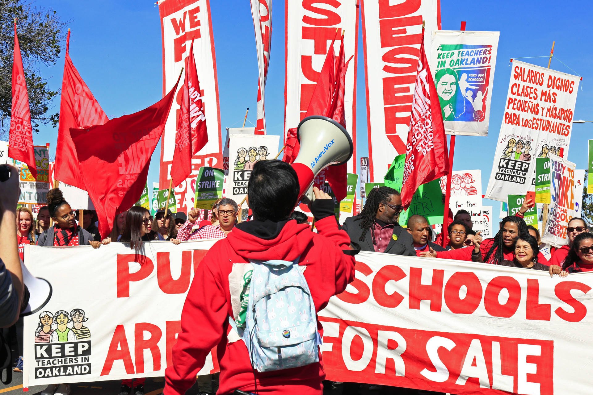 Oakland teachers, joined by student supporters, march down Adeline Street in West Oakland on Feb. 22, 2019, the second day of a districtwide teachers strike.

 Stephanie Lister/KQED