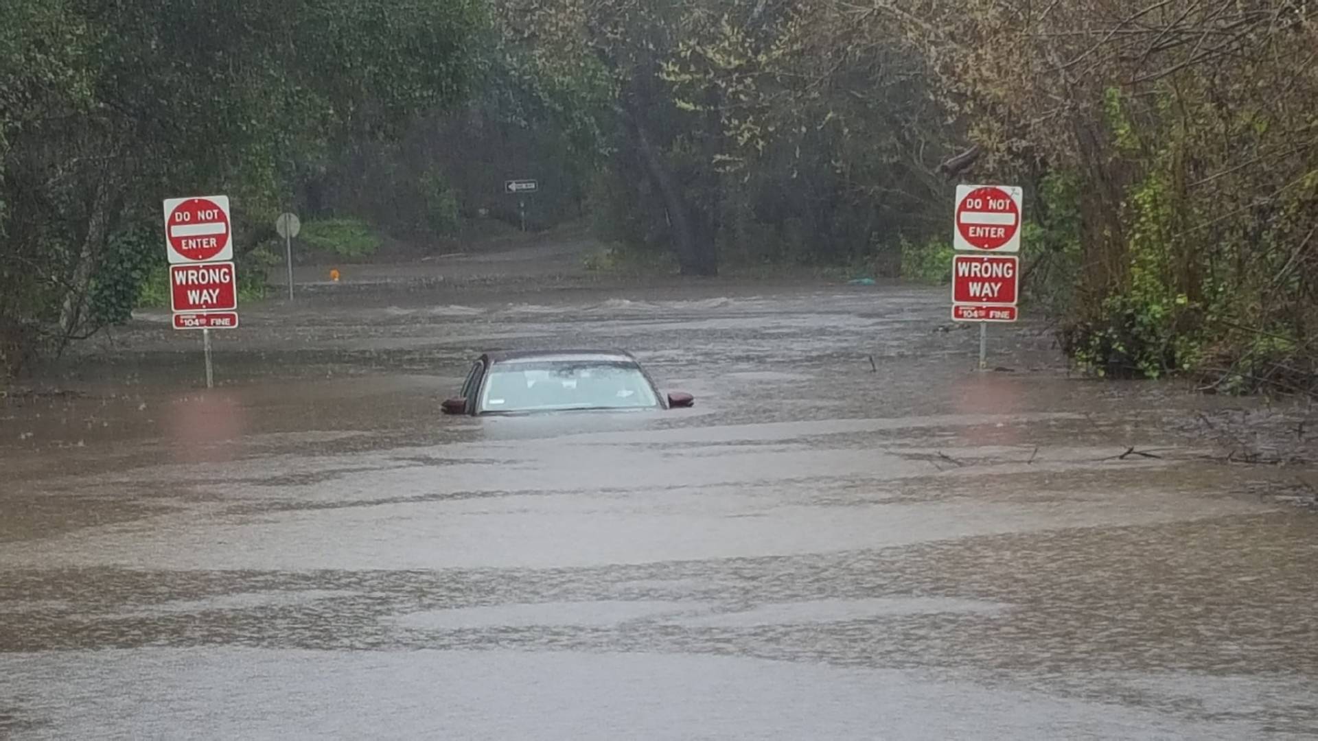 A car was submerged Wednesday in  floodwaters from Arana Creek in Santa Cruz.  California Highway Patrol