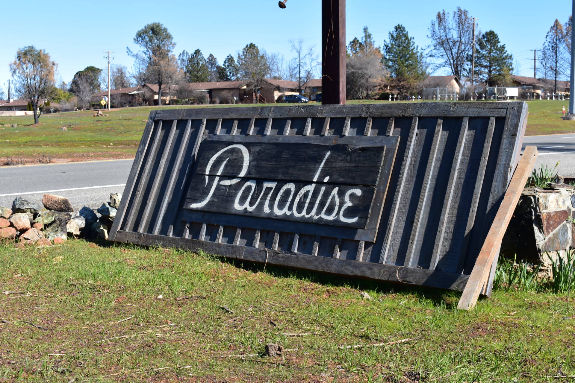 A makeshift sign welcoming drivers to Paradise sits along Skyway. Jeremy Siegel/KQED