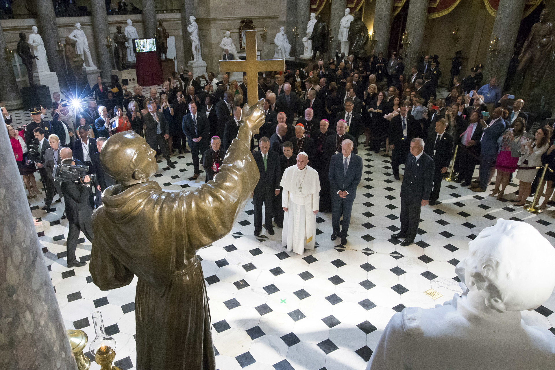 Pope Francis pauses in front of a sculpture of Spanish-born Junipero Serra, the Franciscan Friar known for starting missions in California, in Statuary Hall at the U.S. Capitol on September 24, 2015 in Washington, DC.