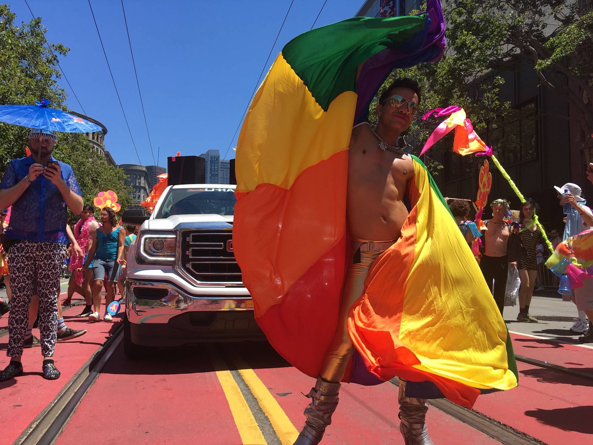 A parade participant dances in front of community grand Marshall Brian “Chickpea” Busta at the 2018 San Francisco Pride parade. Anne Wernikoff/KQED