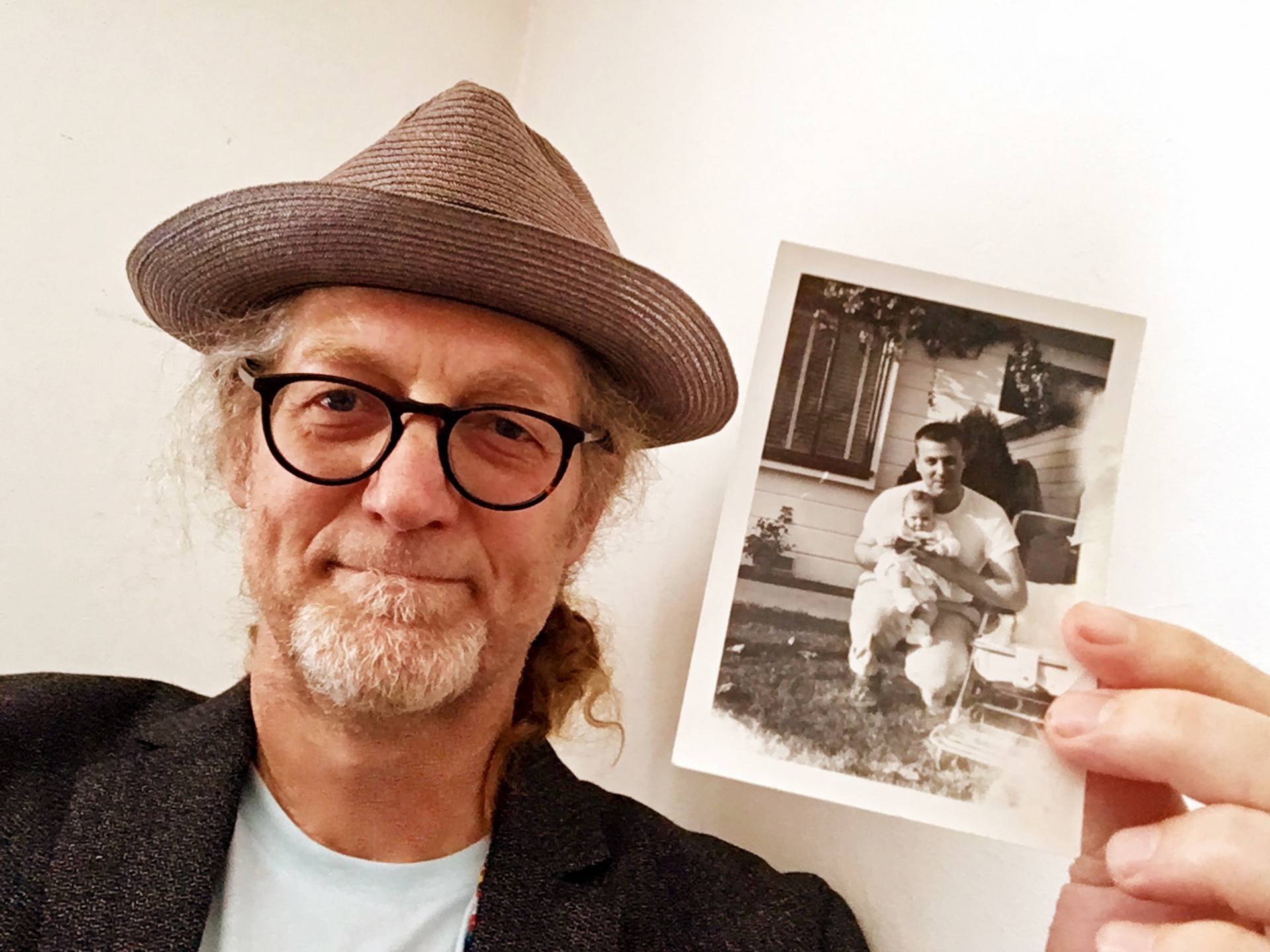 John Borg holds a photo of his father Joseph and his sister Mary in the 1950s. Courtesy of John Borg