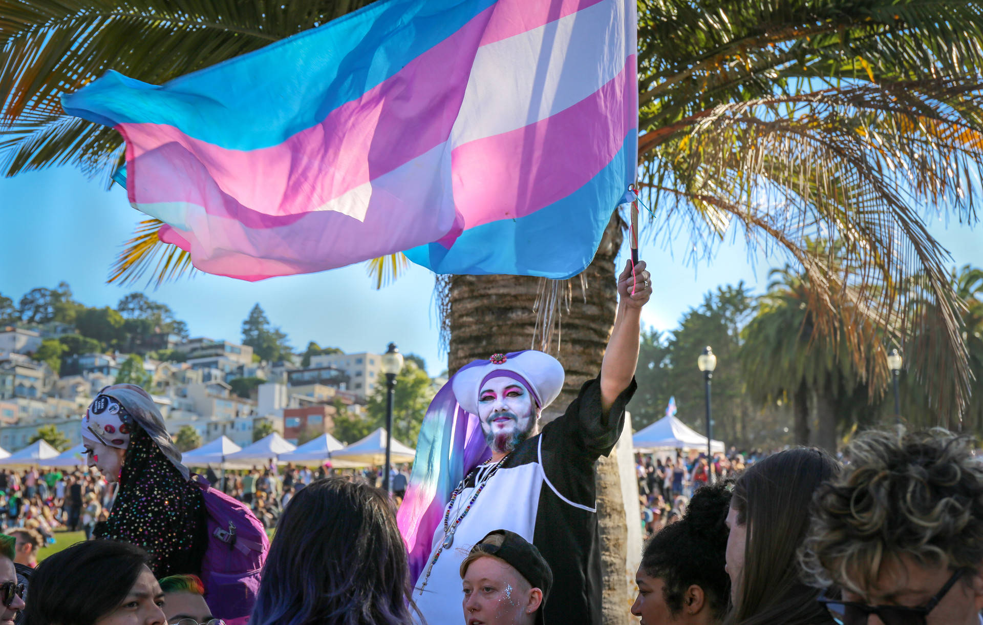 The transgender pride flag is held high during the Trans March at Dolores Park on June 28, 2019. Sruti Mamidanna/KQED