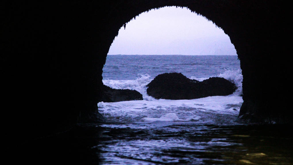 A view of the Pacific Ocean at dawn, from inside a dark tunnel below San Francisco. Sruti Mamidanna/KQED