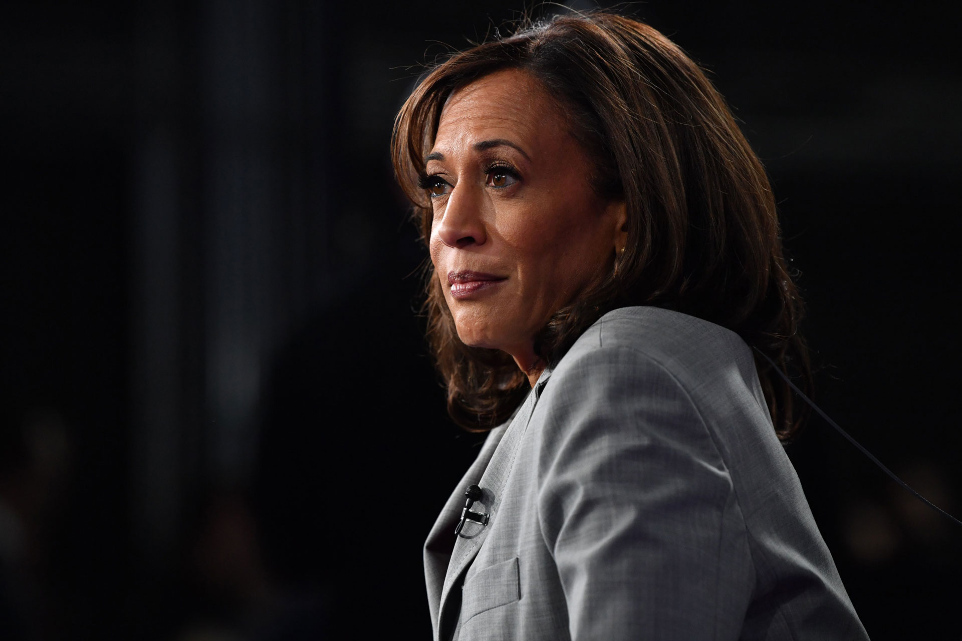 California Sen. Kamala Harris speaks to the press after participating in a Democratic primary debate on Nov. 20. Harris announced Tuesday that she's dropping out of the presidential race.