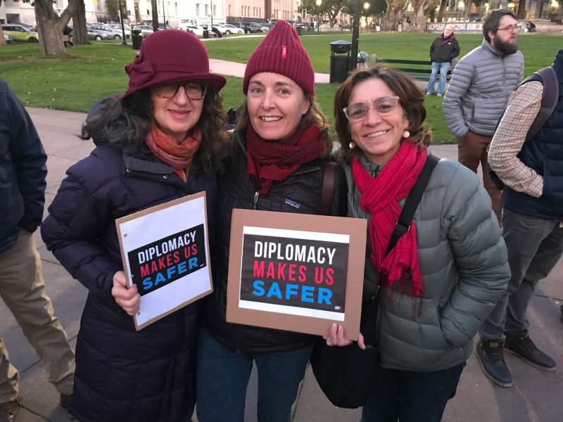 From left to right: Anita Amirrezvani, Parsis Karim and Katherine Whitney at an anti-war protest in San Francisco on Jan. 9, 2020.