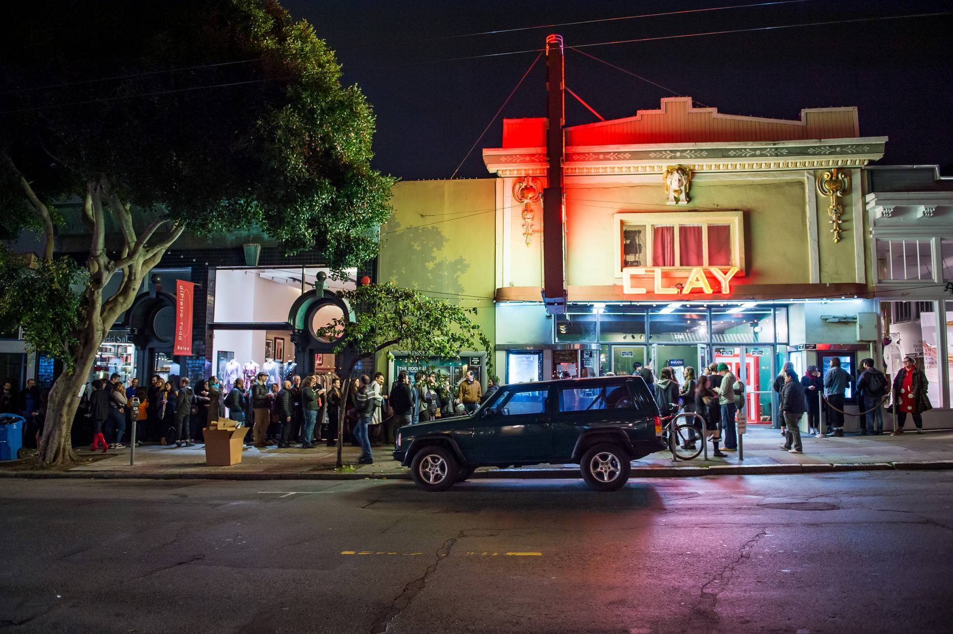 Crowds line the sidewalk waiting to enter the Clay Theater for a sold-out performance of the Rocky Horror Picture show on Saturday. This midnight movie performance is the last for the theater, which is shutting its doors on Sunday after 110 years. Beth LaBerge/KQED