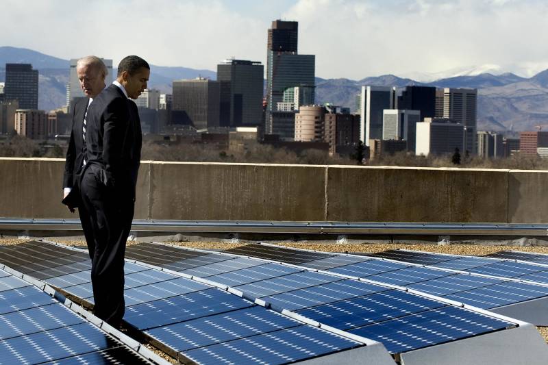 U.S. President Barack Obama and Vice President Joe Biden look at solar panels as they tour the solar array at the Denver Museum of Nature and Science in Denver, Colorado, February 17, 2009.