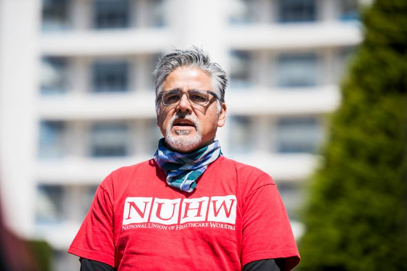 John Avalos, former San Francisco Supervisor and an organizer for the National Union of Healthcare Workers, speaks at a press conference at Seton Medical Center on April 2, 2020. 