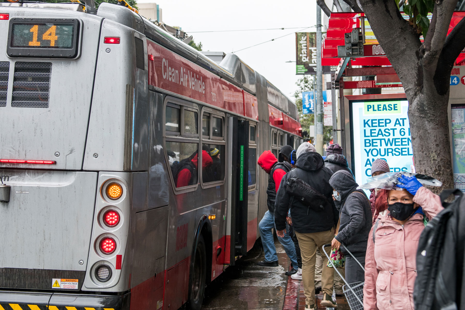 Passengers board the 14-Mission on 4th and Mission Streets in San Francisco on April 6, 2020.