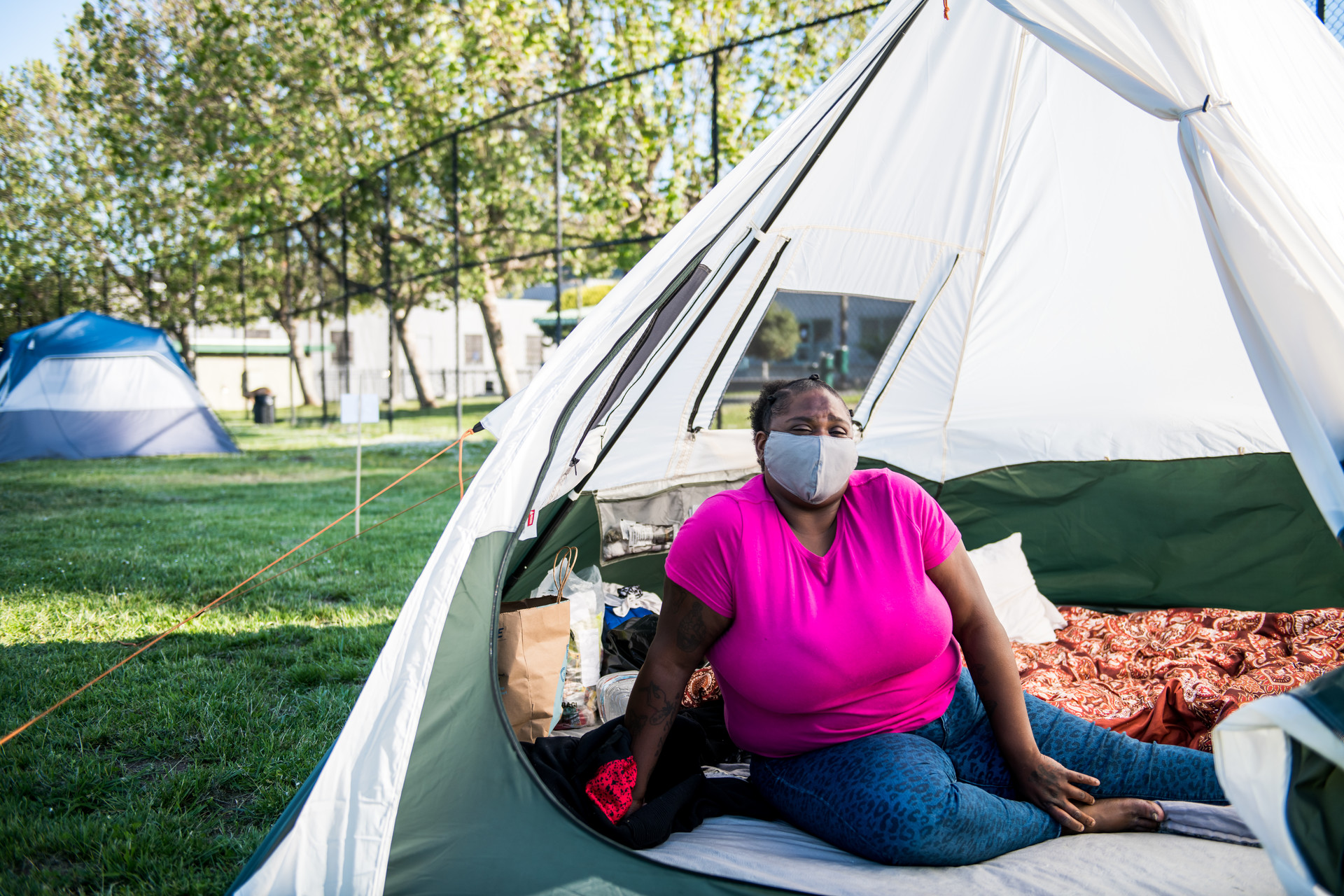 Tasha Swift sits inside her tent at the Bay View Park K.C. Jones Playground on May 5, 2020.