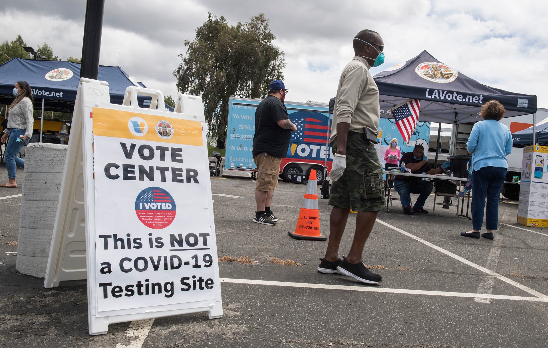 People wait to vote at a voting station for the special election between Democratic state assemblywoman Christy Smith and Republican businessman and ex-Navy pilot Mike Garcia to replace former Democratic Congresswoman Katie Hill in the state's 25th Congressional District, in Santa Clarita on May 12, 2020.