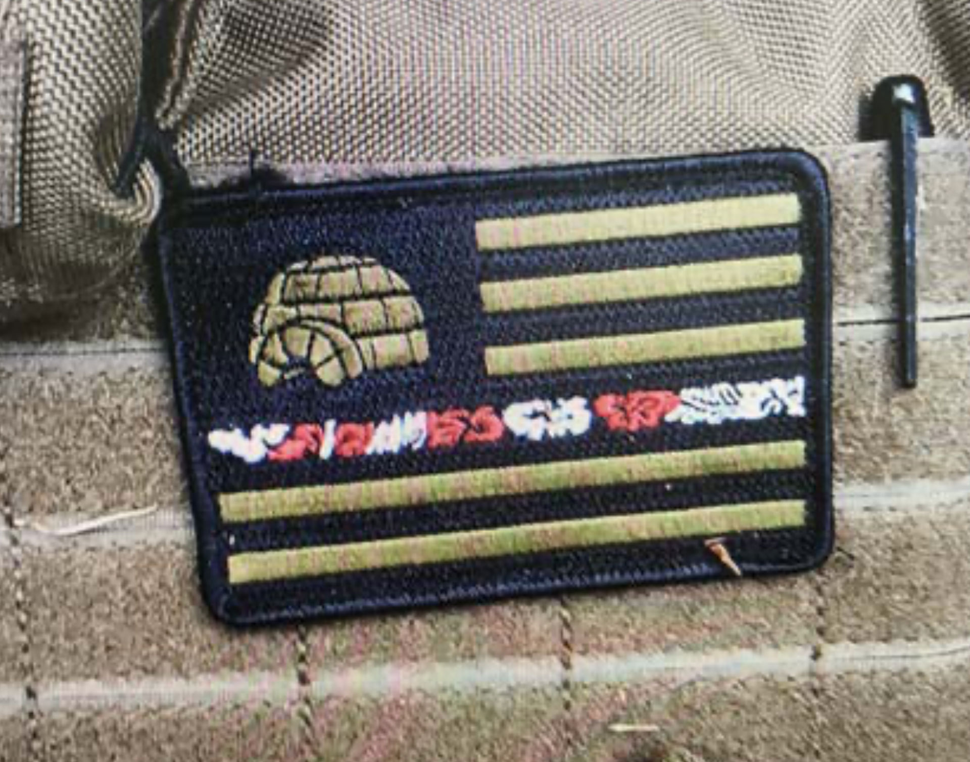 A patch with symbols associated with the far-right 'Boogaloo' movement was found sewn onto Steven Carrillo's ballistic vest following a search of his van by law enforcement.