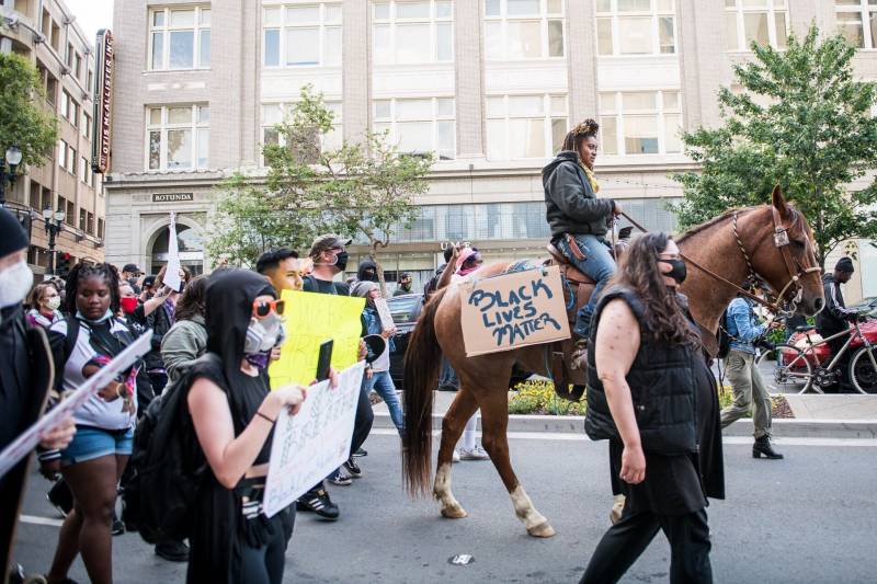 Brianna Noble rode among demonstrators marching on Broadway in Oakland on May 29, 2020, during a protest over the Minneapolis police killing of George Floyd.