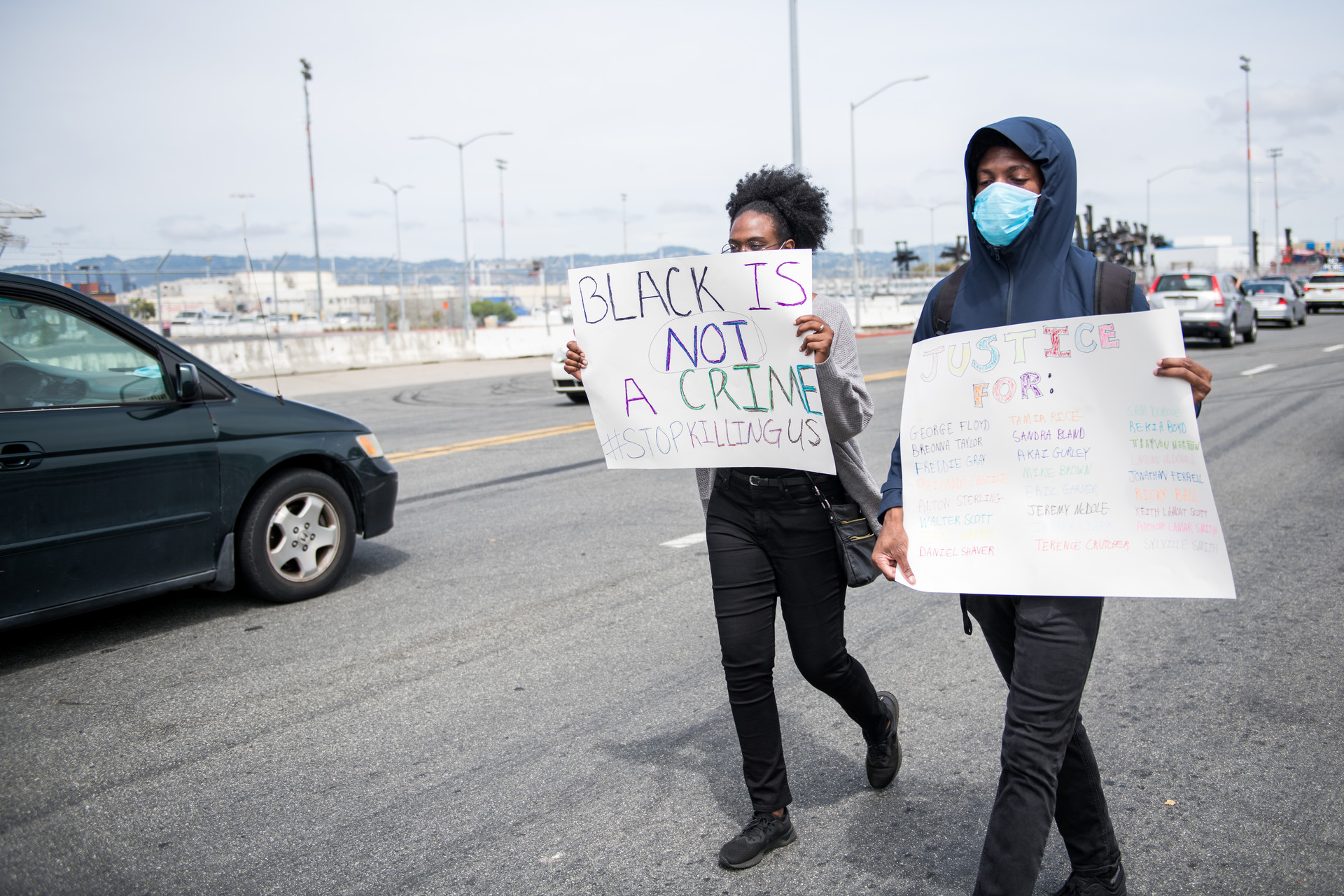 Demonstrators on foot joined thousands of vehicles lined up at the Port of Oakland before departing for Lake Merritt on Sunday.