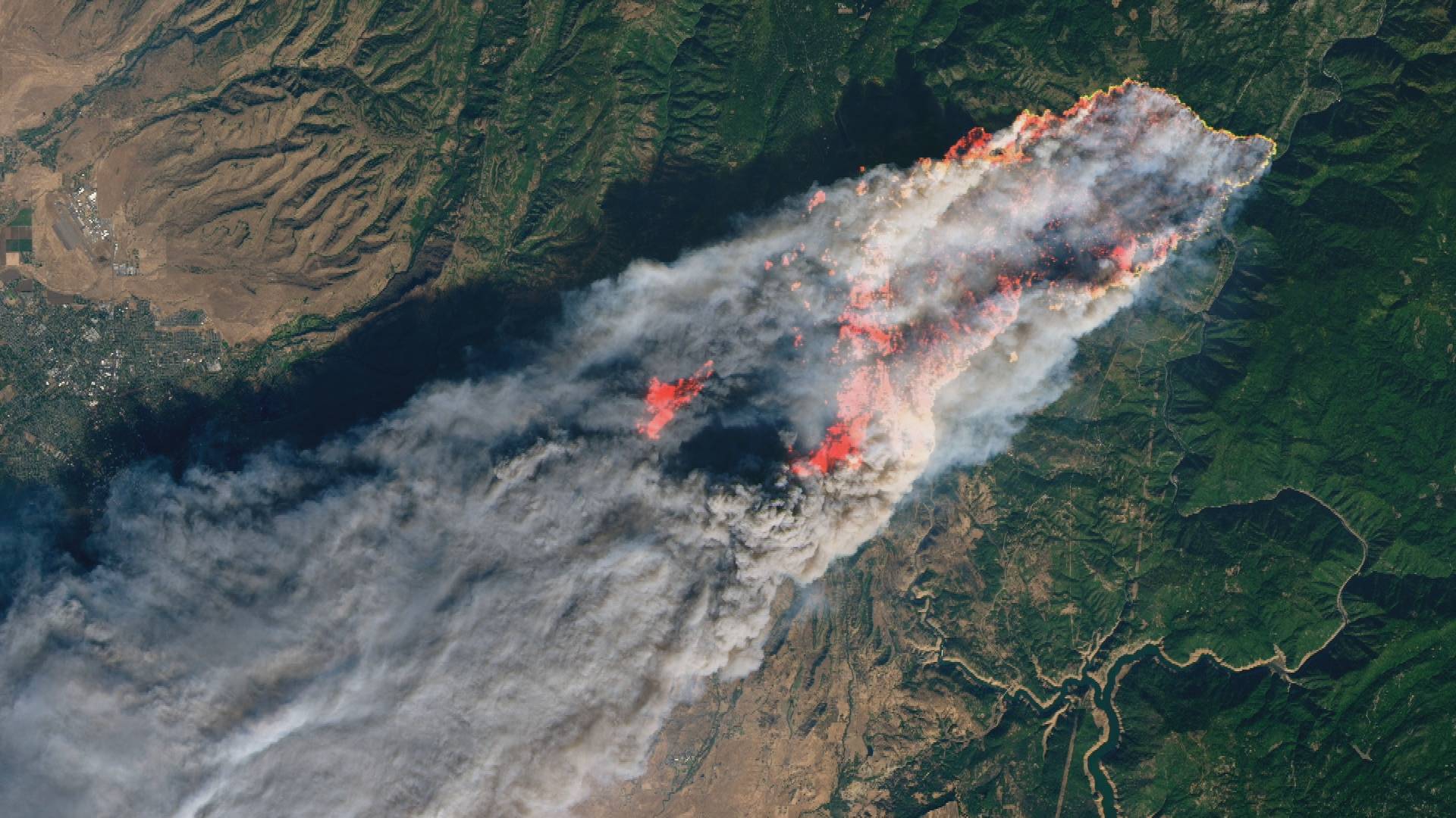 A satellite image shows the Camp Fire - driven by high winds after it was sparked by PG&E equipment - as it consumes the town of Paradise in Nov., 2018. The blaze remains the deadliest and most destructive in California history.