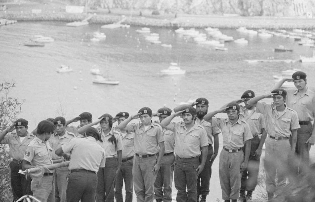 The Brown Berets salute at their camp on Catalina Island.  Maria Marquez Sanchez, La Raza photograph collection. Courtesy of UCLA Chicano Studies Research Center