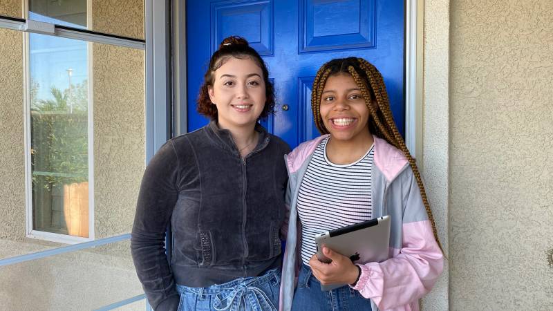 Ariel Johnson (right) and her sister Kaileia Johnson said they often must wait until midnight to do their homework because their internet, which is provided by Frontier, is so slow they can't be on it while family members are using it for work during the day.