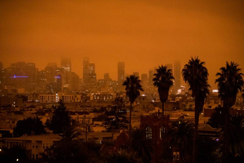 A view of the San Francisco skyline, with an orange sky.