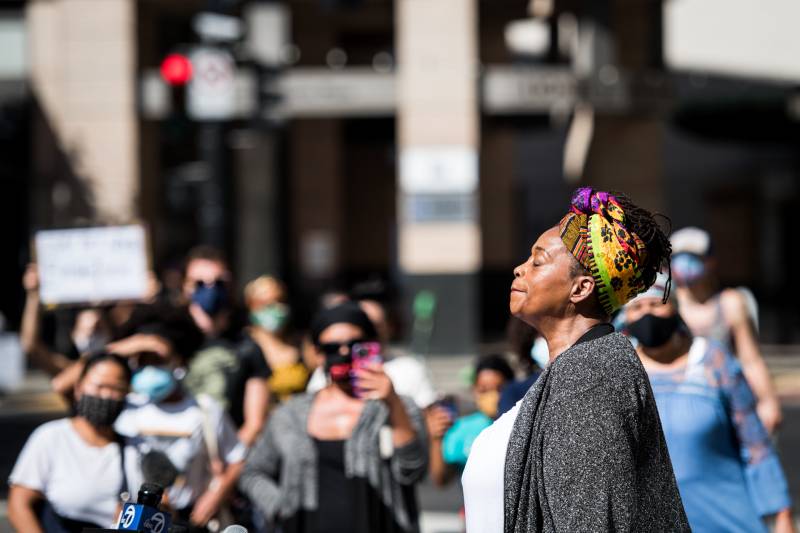 Ayodele Nzinga, director of Lower Bottom Playaz, speaks out against the killings of Breonna Taylor and other Black women by police, at a rally in Oakland on Sept. 24, 2020.
