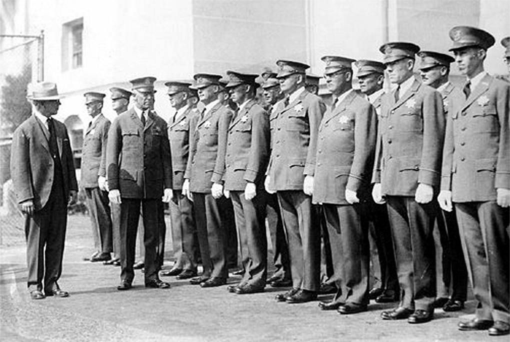 August Vollmer inspects a line of police officers standing at attention. Courtesy of <a href="https://www.cityofberkeley.info/Police/Home/Historical_Unit.aspx">Berkeley Police Department Historical Unit</a>