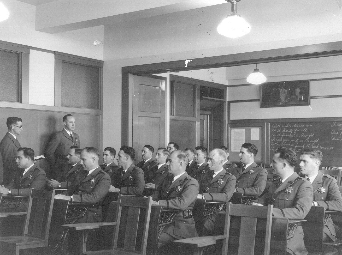 August Vollmer pioneered regular training for his officers. Here police officers listen to a lecture held at Berkeley City Hall in 1935.