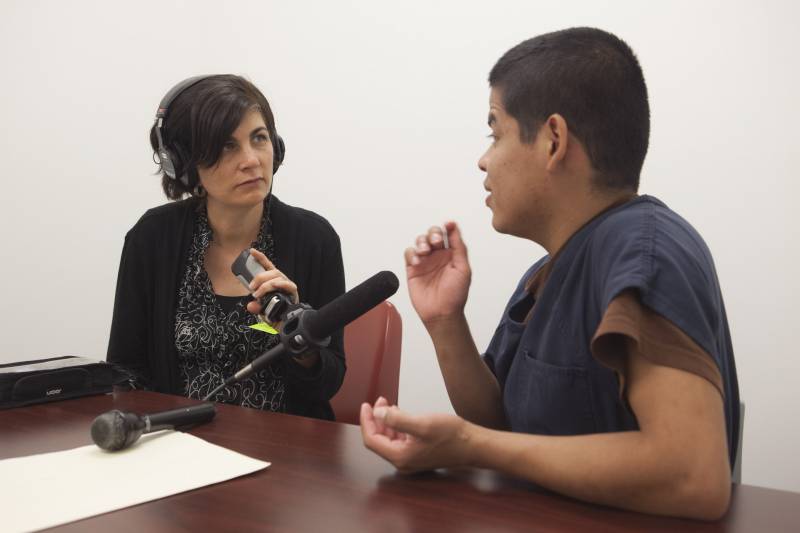 The California Report’s Sasha Khokha interviews Luna Guzmán inside Otay Mesa Detention Center in March 2019. 