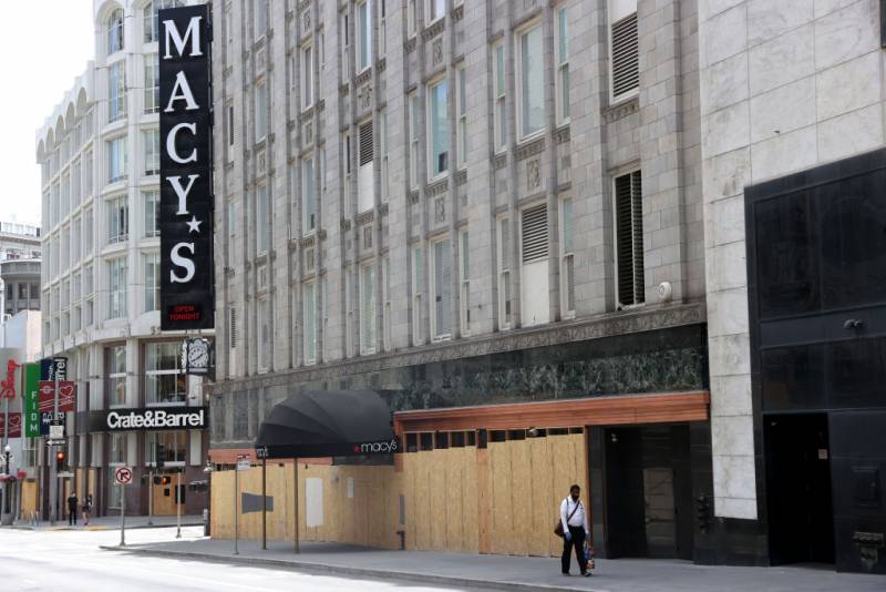 A boarded up Macy's store