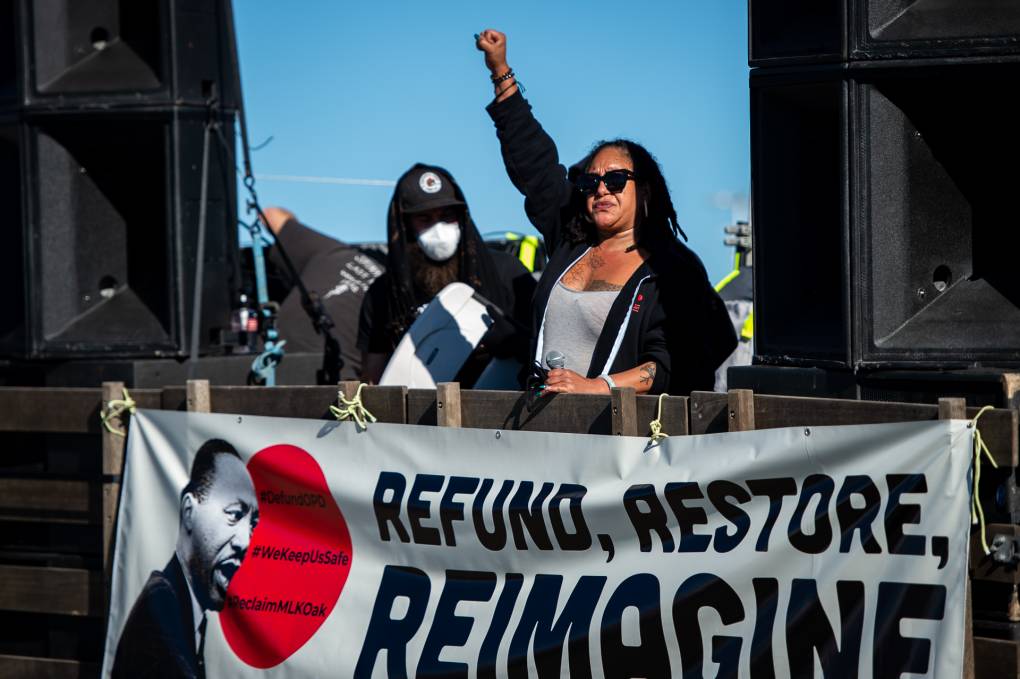 Cat Brooks, co-founder of Anti Police-Terror Project, speaks before a Martin Luther King Day car caravan starting at Middle Harbor Shoreline Park near the Port of Oakland on Jan. 18, 2021.