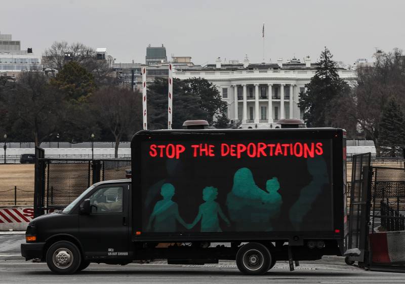 An L.E.D. truck displaying messages expressing concern over the continuing mass deportations of Black immigrants drives past the White House prior to a #BidenAlsoDeports rally on February 15, 2021 in Washington, DC.
