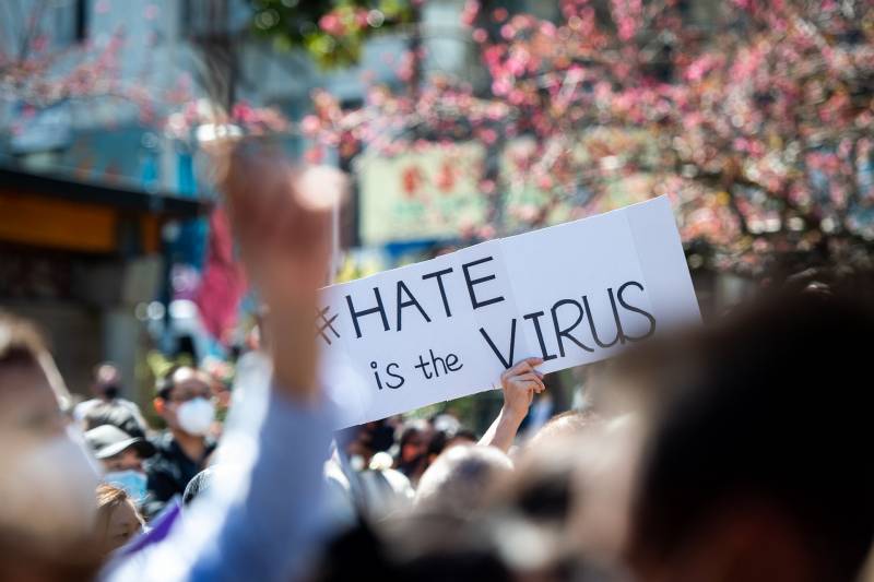 A 'Hate is the Virus ' sign. Hundreds gather at Portsmouth Square in San Francisco’s Chinatown on March 20, 2021, for a Stop AAPI Hate rally which made space for people to grieve, make art and to honor the lives lost to recent anti-Asian violence.