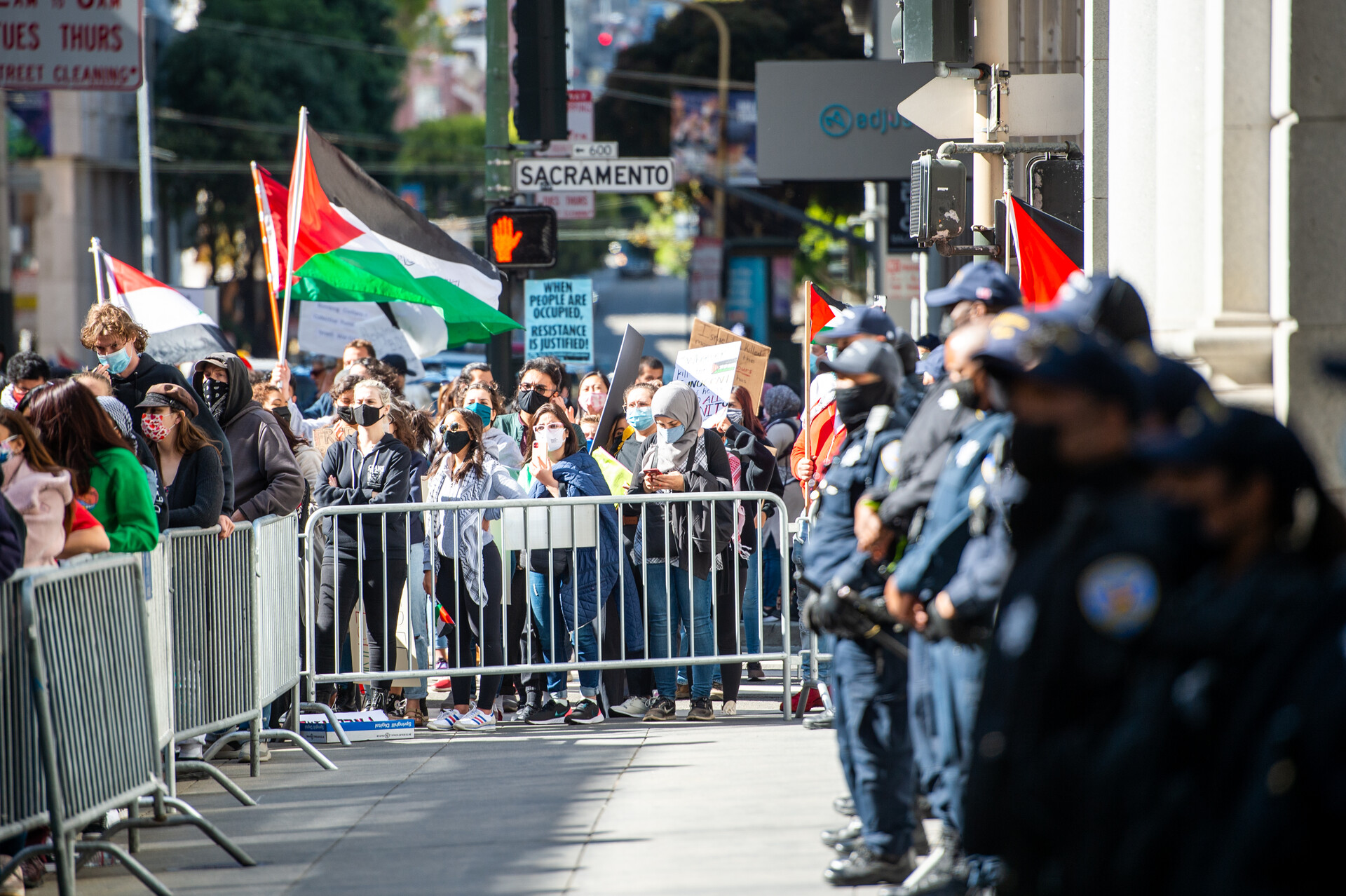 A line of police stand in front of the Israeli Consulate during a rally in solidarity with Palestine in San Francisco on May 18, 2021.