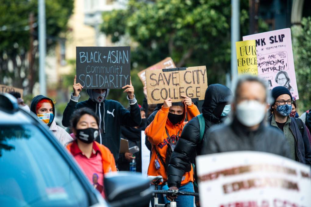 Demonstrators march through the Castro neighborhood during a rally in San Francisco on May 6, 2021, to protest layoffs and cuts at City College of San Francisco. Beth LaBerge/KQED