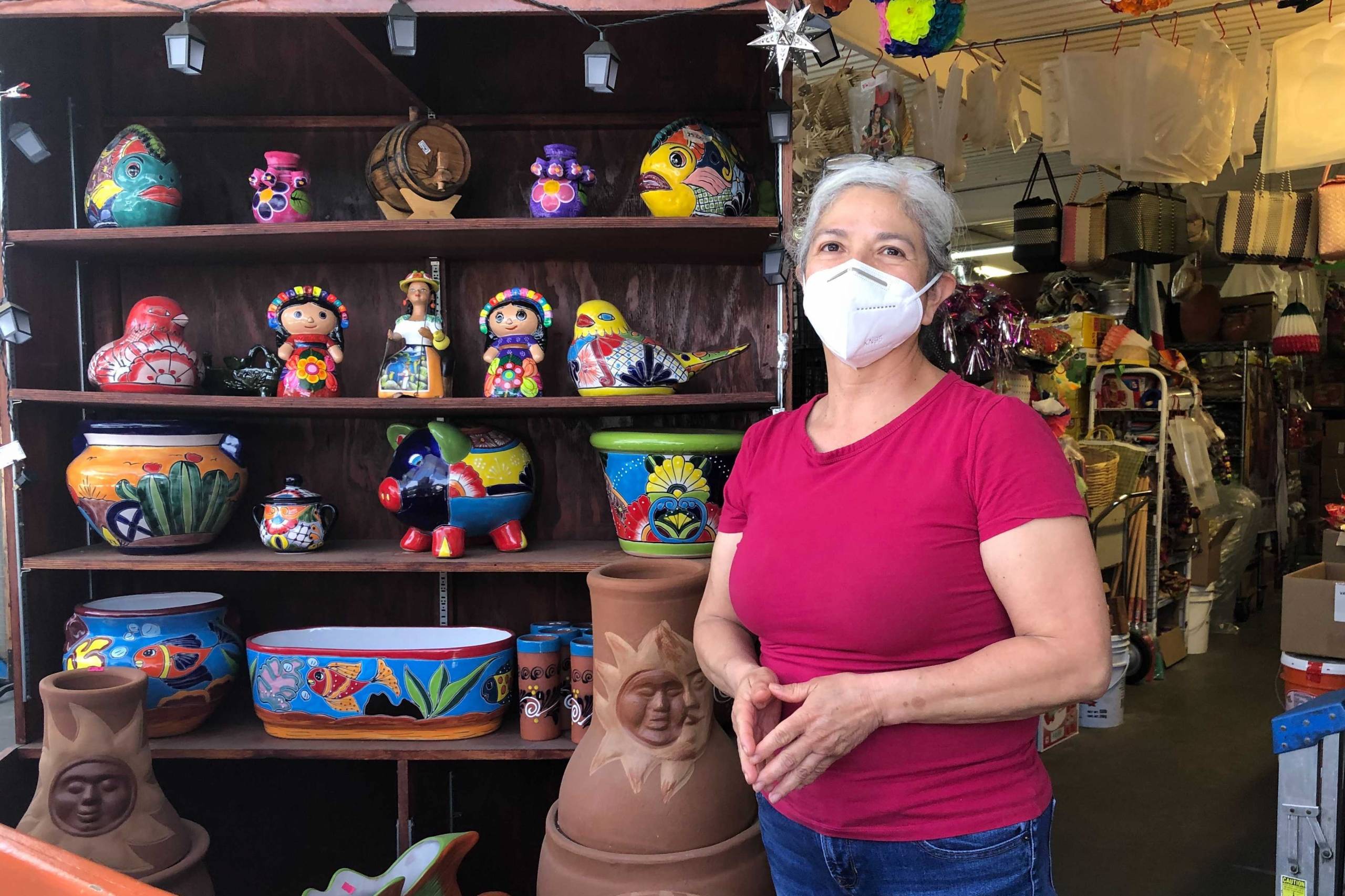 Ana Vázquez, a merchant at the San Jose Flea Market, stands next to her stall.
