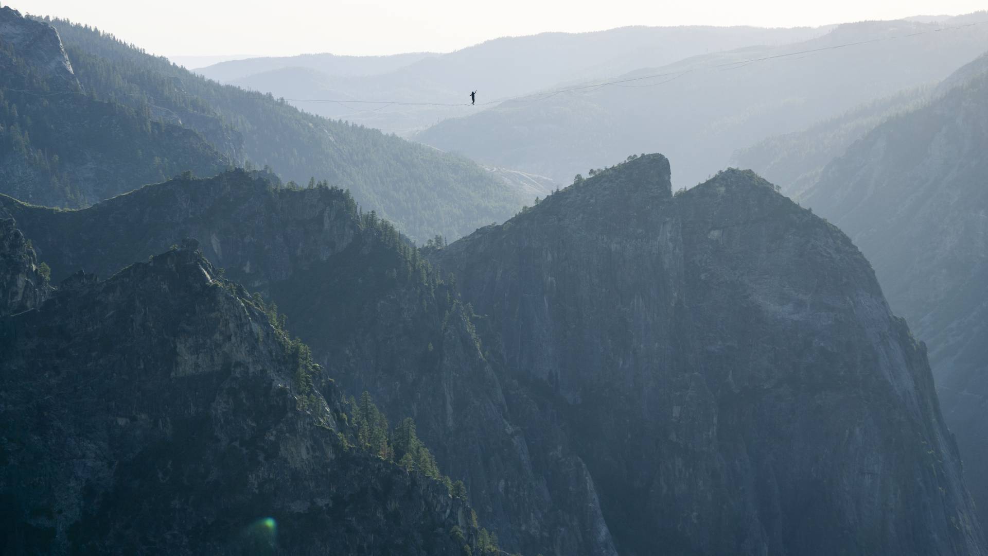 Moises Monterrubio walks a highline 1,600 feet in the air at Yosemite National Park in June. The line stretched 2,800 feet, setting a record in Yosemite and in California, according to the International Slackline Association. Ryan Sheridan/Moises Monterrubio