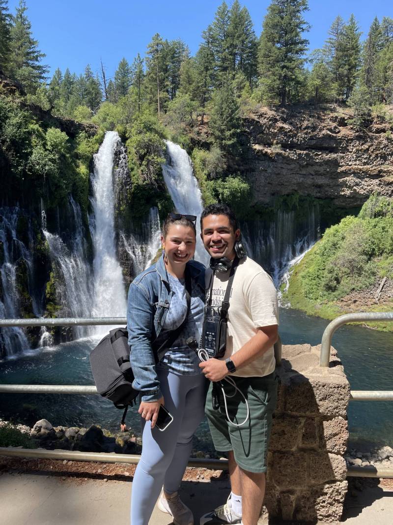 Couple posing in front of falls