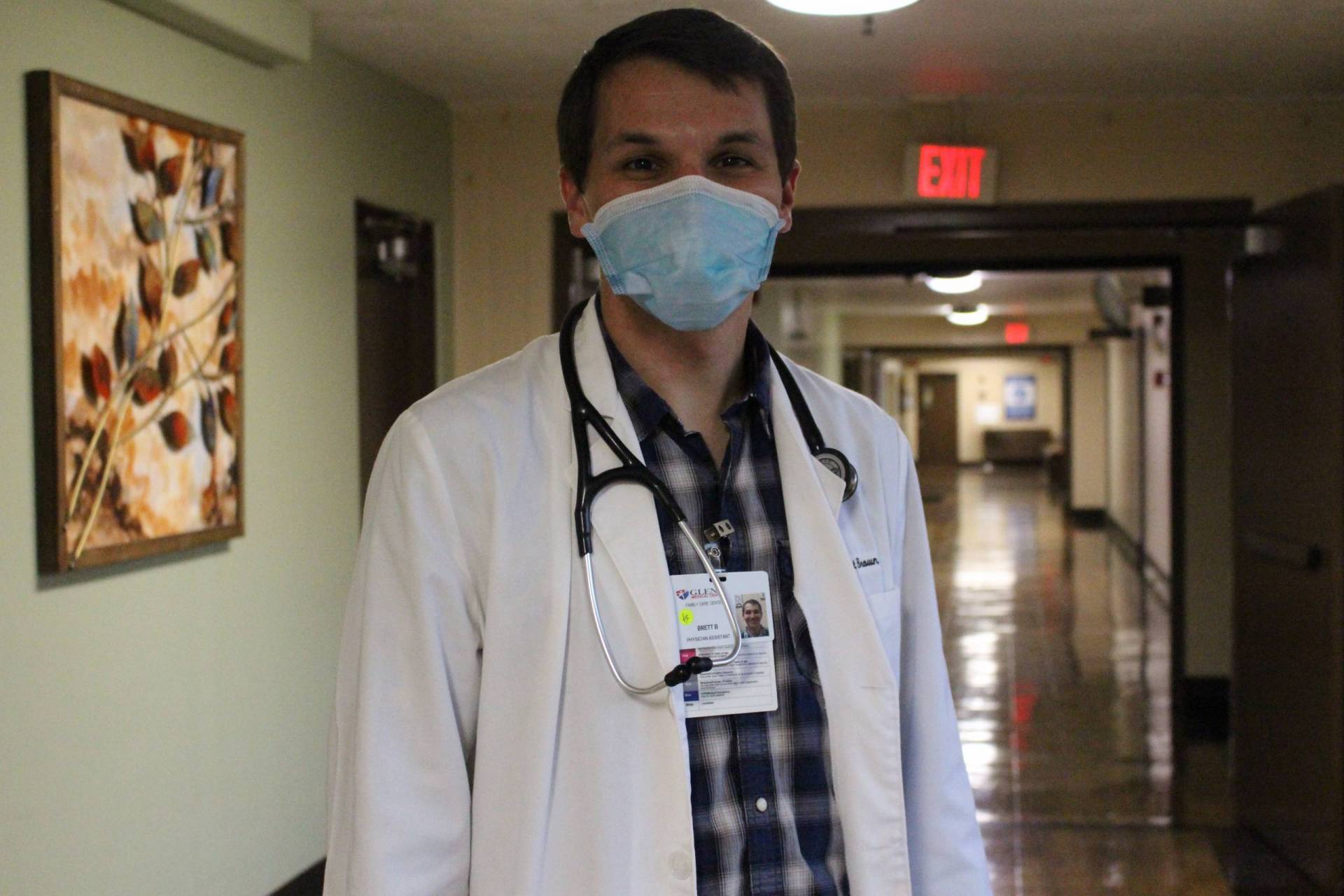 Man in white lab coat with stethoscope around his neck.