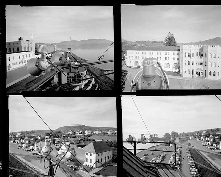 Four black-and-white aerial photos show the parking lot, the facade, outbuildings and the bay.
