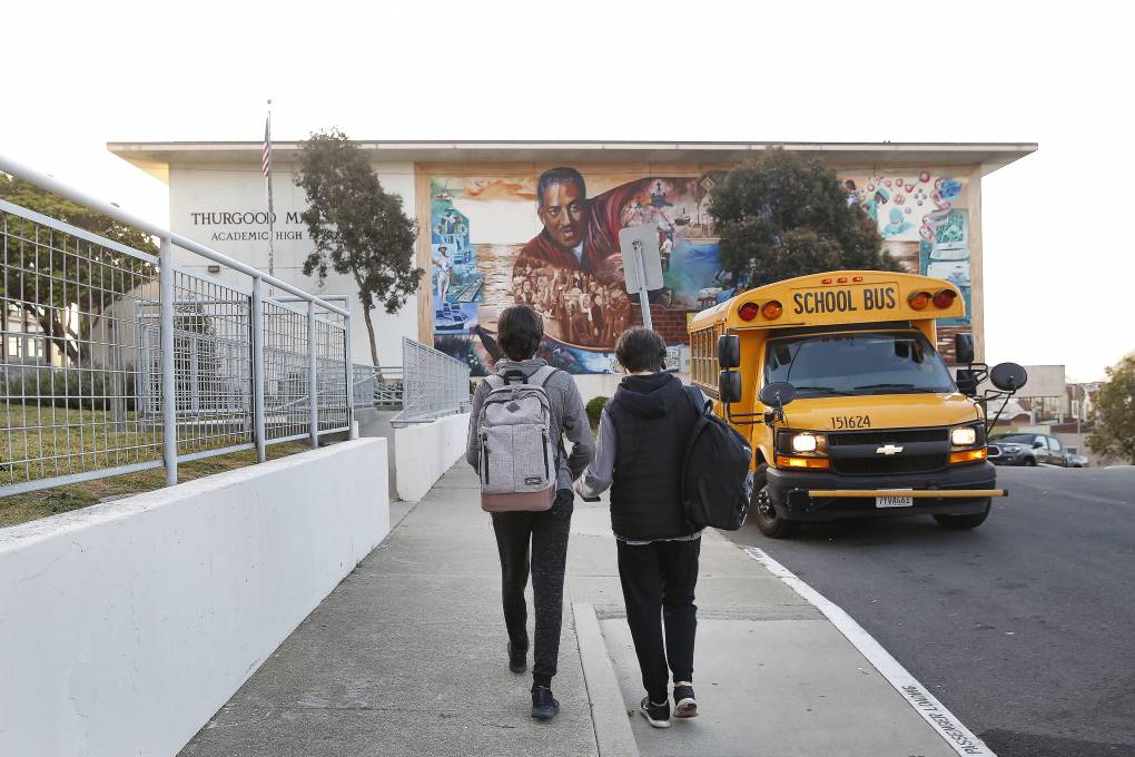 Two San Francisco high school students walk to school.