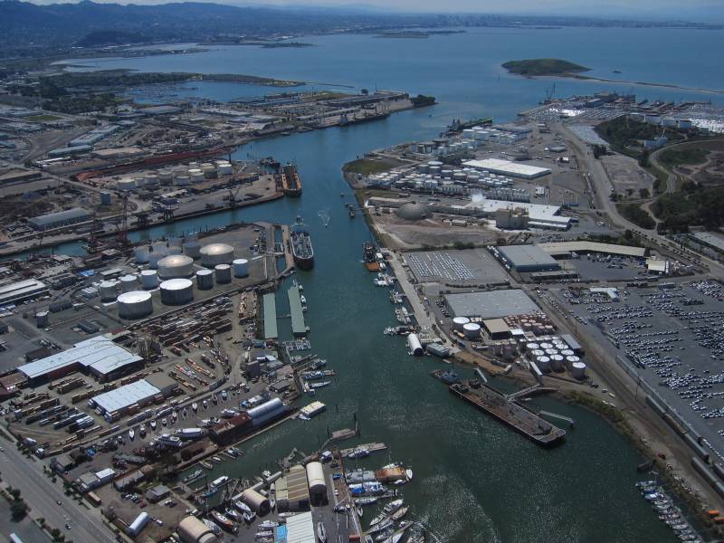 An aerial view of a port with buildings and water.