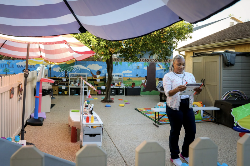 Tonya Muhammad walks through the playground of her child care.