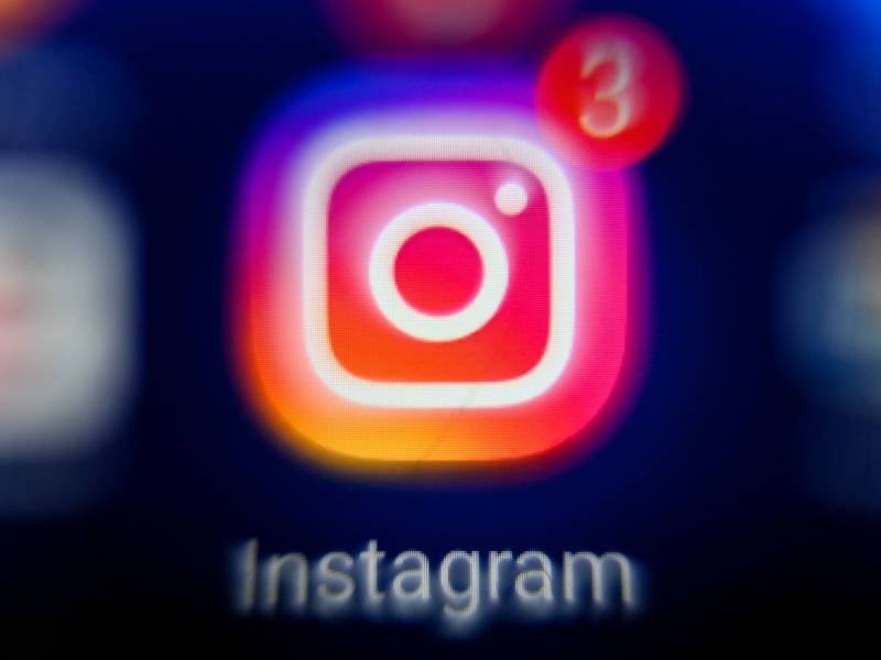 A logo of Instagram resembling a camera in pink, red, orange and blue colors blended together with the number three in the right hand corner.